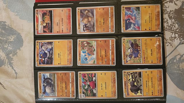 A photographed Pokémon card binder page, ready to scan